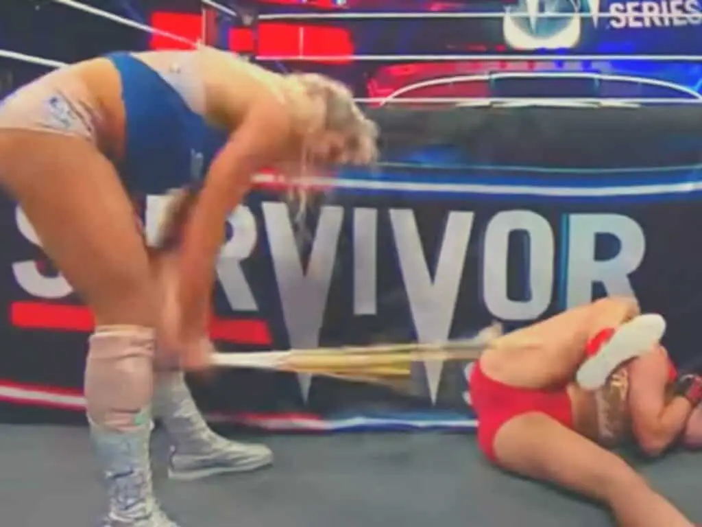 Charlotte Flair Breaks a Kendo Stick Attacking Rousey